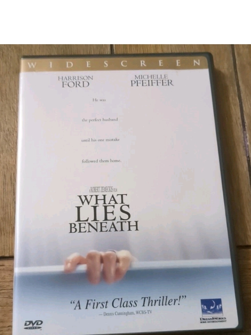 What Lies Beneath DVD — White and Light Blue Widescreen